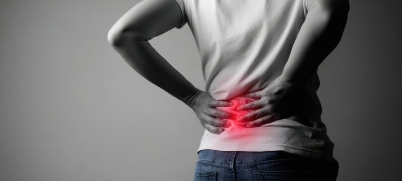 The Person Experiencing Lower Back Pain with Highlighted Area.