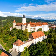 Obraz premium Aerial view of a medieval castle complex nestled in a valley