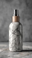 Marble spray bottle on a gray surface