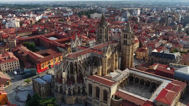 aerial view of Leon Cathedral, Camino de Santiago pilgrimage in Spain, tourist landmark in Castilla y Leon, flying above a medieval gothic cathedral in Leon, Spain