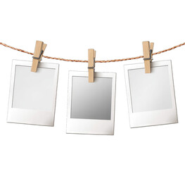 Three blank instant photos hanging on a rope