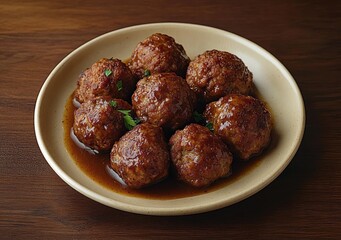 Plate of seven juicy meatballs covered in brown gravy with small green herb garnishes served on beige plate over wooden table