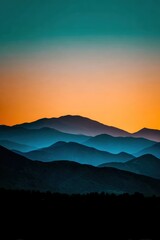 Fototapeta premium Majestic mountains under a vibrant sunset sky