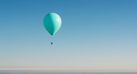 Fototapeta premium A single turquoise balloon floating in a clear blue sky