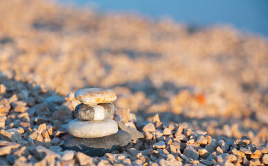 Balanced stones on a pebble beach harmony and positive thinking concept. Calmness, balance of body, mind, soul and spirit. Mental health practice