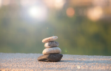 Balanced stones on a pebble beach harmony and positive thinking concept. Calmness, balance of body, mind, soul and spirit. Mental health practice