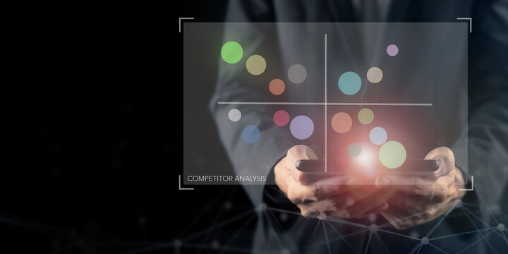 Competitor Analysis Data Visualization. A professional holds a digital tablet displaying a quadrant chart used for competitor analysis. Data analytics, strategic planning, and market intelligence.