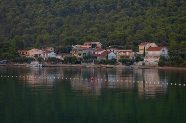 Beautiful seascape at sunset. Houses on the beach with sea view.