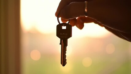 Hand Holding Key  Real Estate, New Home, Homeowner Silhouette - Powered by Adobe