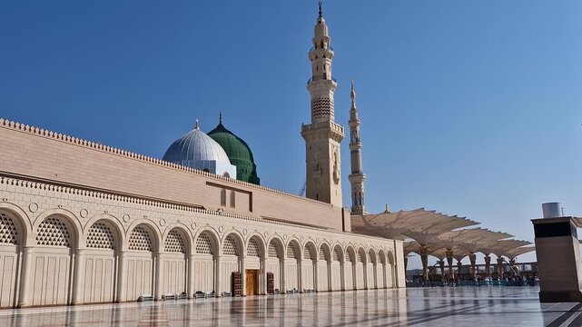 Static view of green and silver dome of Nabawi mosque in Medina, Saudi Arabia. 