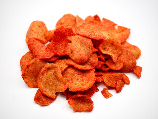 Pile of traditional Indonesian spicy basreng chips placed on a white background, perfect for food concept and snack advertising