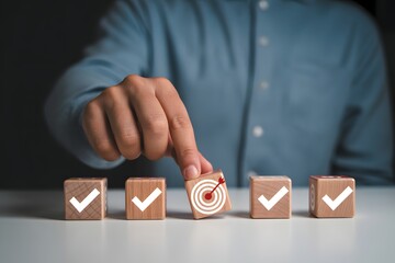 Person placing a target block among checkmark blocks representing goals and achievements concept