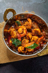 Authentic Kerala style prawn ghee roast, spicy South Indian seafood delicacy made with fresh prawns, clarified butter, roasted spices and curry leaves, traditional Malabar coastal dish