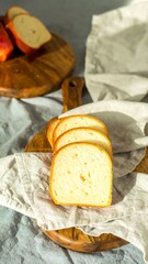 Slices of light bread on wooden boards