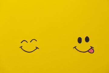 A joyful emotion of love and success - smiling faces on a yellow background. Emotions, joy, happiness
