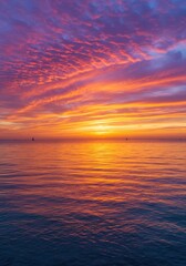 Obraz premium Vibrant Ocean Sunset with Pink and Orange Clouds
