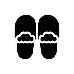 Two black slippers with white fluffy lining are displayed in a simple and monochrome design, close up view
