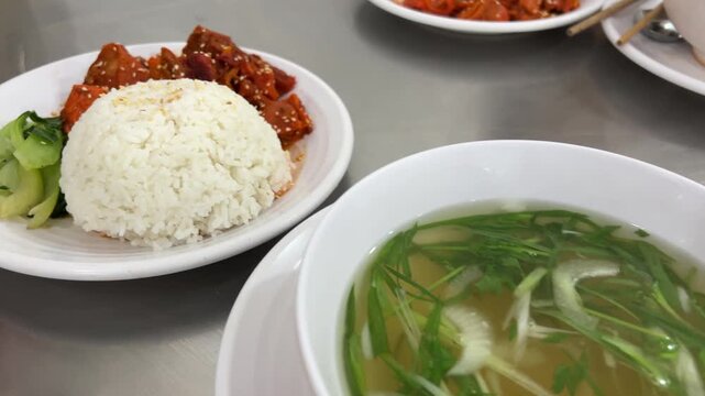 Rice soup greens food. white rice, green vegetables and instant noodles are combined to eat. examples of unhealthy foods. High quality 4k footage