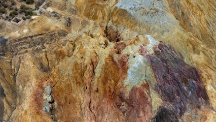 Aerial view of the arid, colorful earth of the abandoned Mazarrón mine, Murcia Region, Spain.