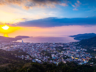 Aerial view of beautiful sunset sky over mountains with sea at Patong bay Phuket city Thailand