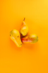 pears on a yellow background.