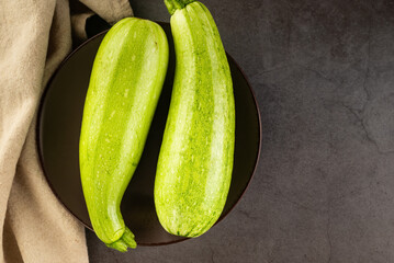 Fresh young zucchini on Dark Table - Summer Harvest