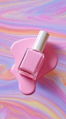 Pink nail polish bottle on a colorful marbled surface