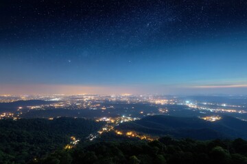 Fototapeta premium Contrast between starlit rural area and bright cityscape showing light pollution boundary 