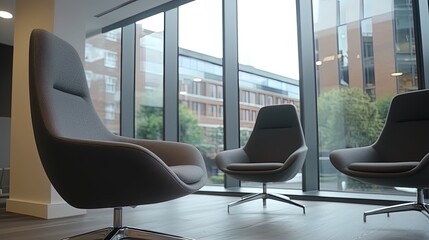 Modern office interior with chairs, table and sofa