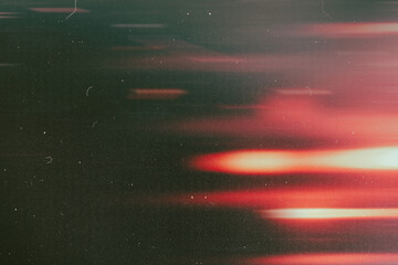 light leak overlay effect with scratch dust and motion blur red light leaks,retro noisy film texture light leak flare on black background,abstract background with ray,grunge film strip background