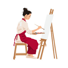 Fototapeta premium A painter deeply engrossed in her creative process, bringing a blank canvas to life.