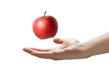 A fresh red apple levitating magically above an open human hand against a clean white background, symbolizing health and knowledge