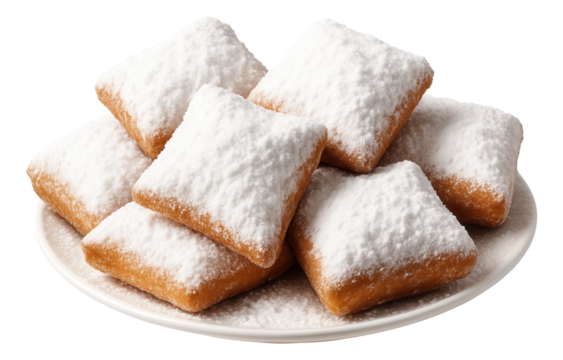 A plate of beignets with a thick covering of powdered sugar creating a snowy effect.