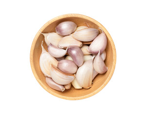 Garlic cloves in a wooden bowl