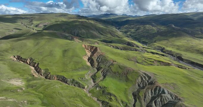Beautiful green grassland and cloudy sky in Litang county, China