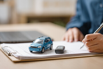 Fototapeta premium Buying car agreement. Car dealershipsigning contract. Purchase automotive agreement. Car insurance protection. Debt expense monthly. Vehicle assurance.