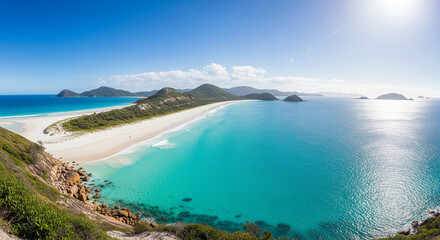 Breathtaking aerial view of a pristine white sand beach with brilliant turquoise water, a paradise-like coastal landscape.