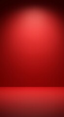 Obraz premium A vibrant red studio background with a gradient spotlight effect, creating a sense of depth and focus.