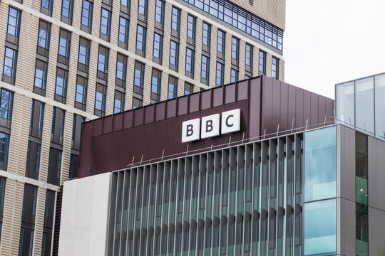 BBC office building exterior with logo on modern glass facade. London, UK, 22 June 2024