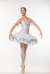 Naklejka premium Studio portrait of a ballerina in a white tutu