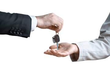 Hand of man in a formal suit handing over car keys to a woman's hand on isolated background. Concept of selling or renting a car