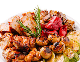 Grilled meat and vegetables platter with aromatic herbs arranged beautifully