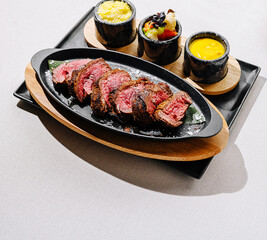 Sizzling steak with vibrant sides for a gourmet dining treat