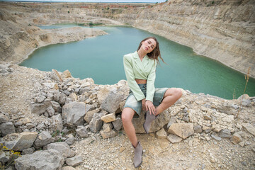 Stylish young beautiful woman posing in Padovskiy quarry