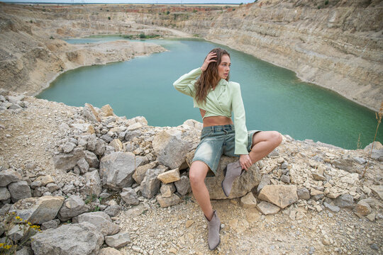Stylish young beautiful woman posing in Padovskiy quarry - Powered by Adobe