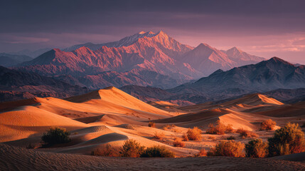 Naklejka premium Majestic Desert Landscape with Golden Sand Dunes and Mountain Range at Sunset, Featuring Warm Light and Dramatic Sky, Creating a Serene and Tranquil Scene, Ideal for Travel, Adventure