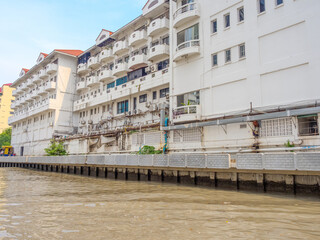Old historical residential house in Phra Khanong on the Khlong a Canal system in BKK used by commuters taking a long tail Boat Ferry system to avoid traffic congestion Bangkok Thailand