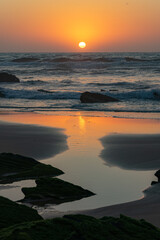 Sunset landscape in the Barriga beach in the Sudoeste Alentejano and Vicentina coast Natural Park. Vila do Bispo, Portugal.