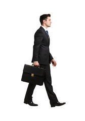Man Walking with Briefcase in Suit Against a Transparent Background