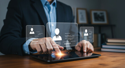 Businessman interacting with digital user profile icons on tablet, technology, and digital connection concept.
